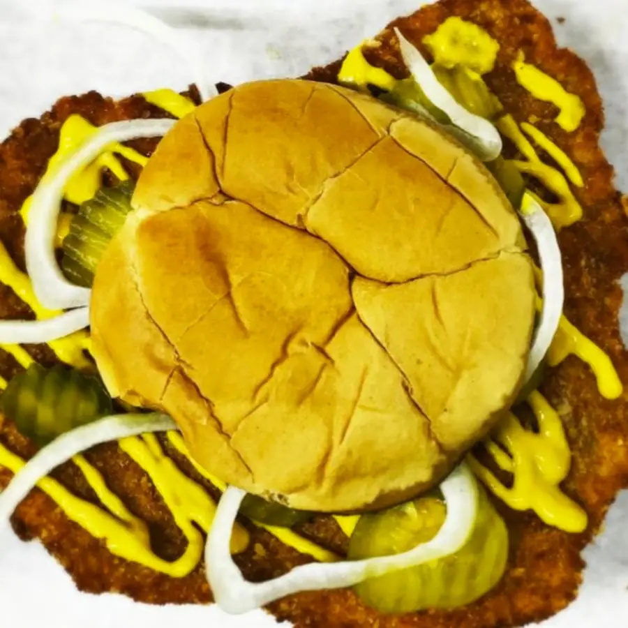 The Midwest Classic Tenderloin, with the breaded pork reaching well past the bun